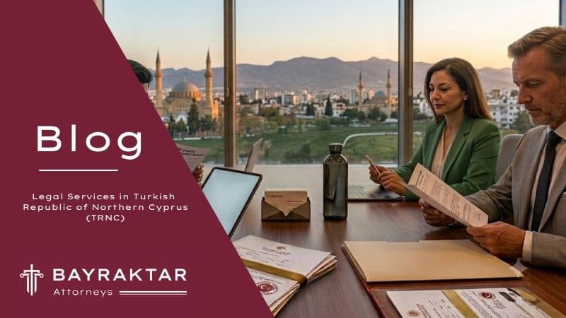 A photograph from an executive office meeting at sunset, where a diverse group of four corporate professionals is reviewing specific TRNC real estate and property development documents, with a clear view of historic Northern Cyprus architecture and a flag through a panoramic window.
