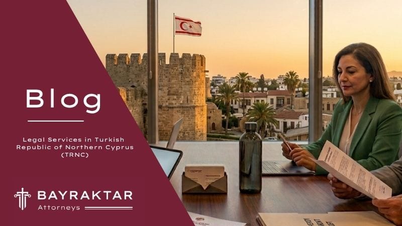 A photograph from an executive office meeting at sunset, where a diverse group of four corporate professionals is reviewing specific TRNC real estate and property development documents, with a clear view of historic Northern Cyprus architecture and a flag through a panoramic window.